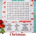 A printable Christmas word search page on a green background with red ornaments surrounding it.