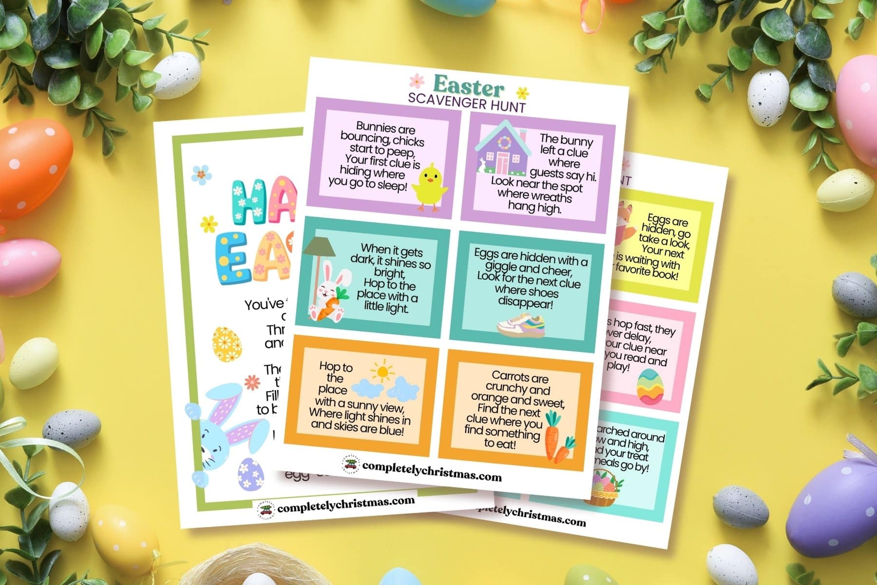 Horizontal display of the full Easter scavenger hunt printable set. Features vibrant clue cards laid out with spring decorations like plastic eggs, carrots, and greenery on a bright yellow backdrop.