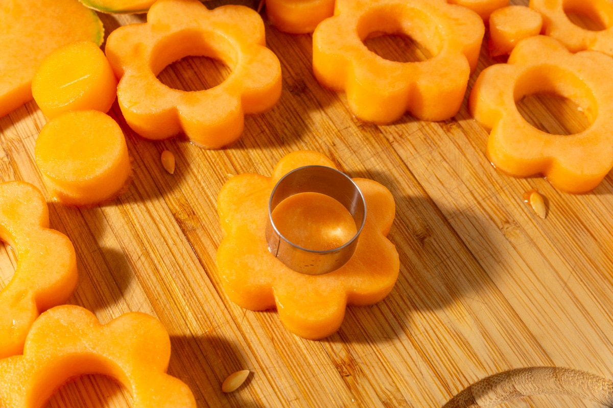 Round cookie cutter used to remove center from cantaloupe flower cutout.