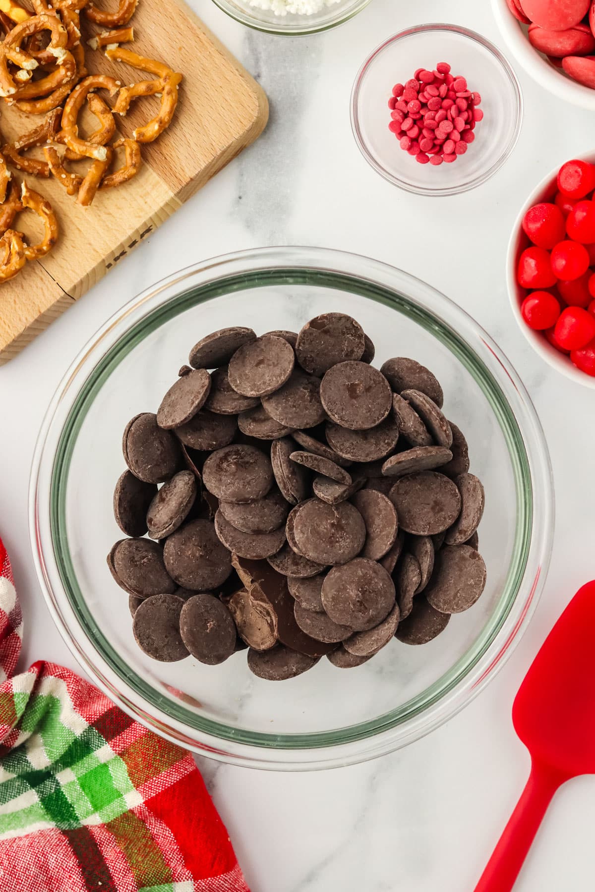 Dark chocolate candy melts in a glass bowl ready to be melted for Nutter Butter Reindeer cookies.
