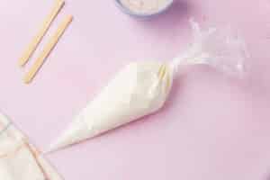 Greek yogurt mixture transferred to a piping bag for shaping Easter bunny yogurt pops.